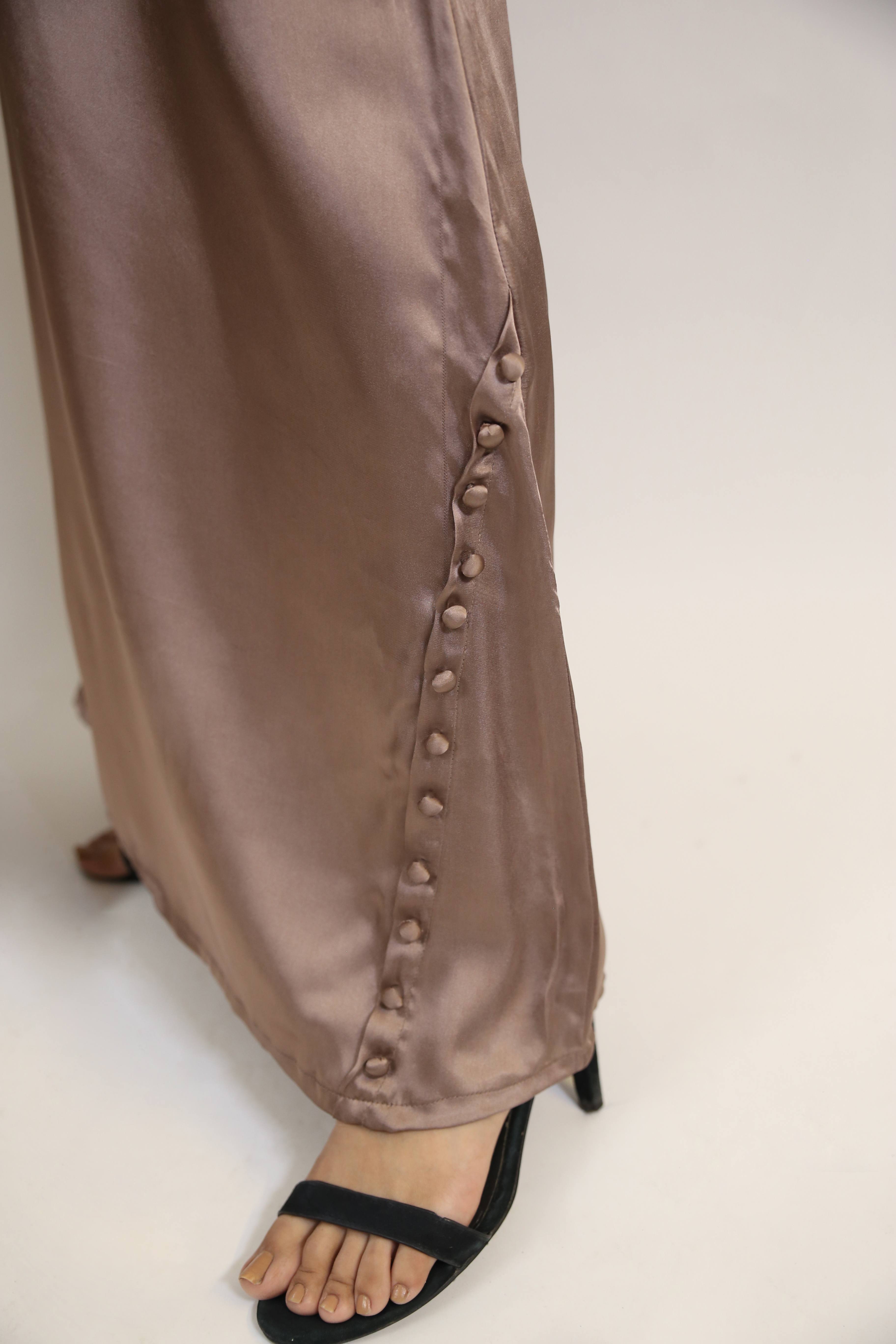 Abeer-Ethereal Satin Maxi Dress with buttoned detailing on neck and hem with bell sleeves- Beige brown