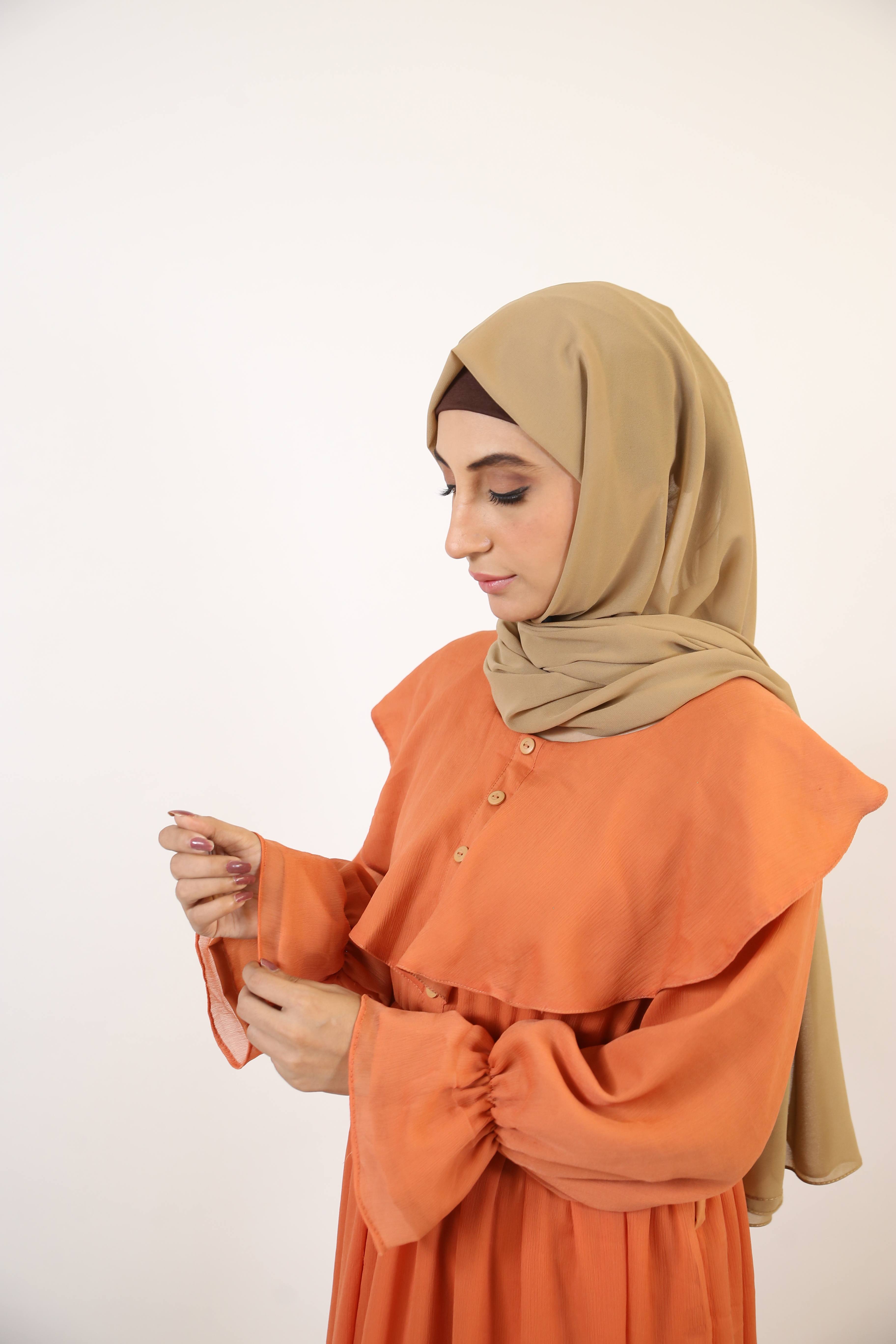 Nahas- Exquisite chiffon fully lined maxi dress with collar detailing and layered hem- Copper Orange